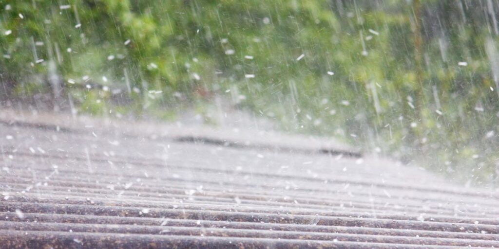 An image of heavy hail pelting a roof.