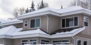 An image of a house with snow on it's roof.