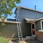 side of a home in loveland with a ladder propped against the wall