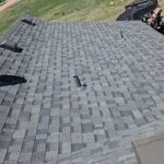 Full roof restoration in Nunn, Colorado. Gray shintles with new vents.