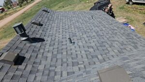 Full roof restoration in Nunn, Colorado. Gray shintles with new vents.