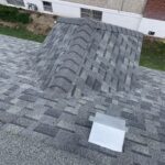 Gray shingles with vent on roof of house